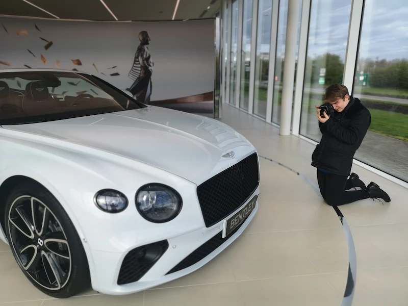 Professional automotive photography session showing attention to detail and creative composition