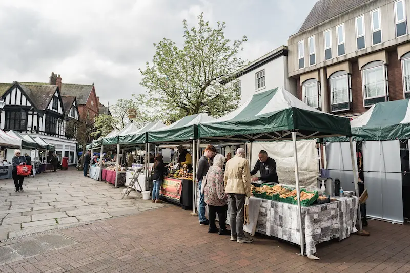 Professional commercial photography of Nantwich Market Square showing local traders and historic market town atmosphere